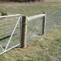 A farm gate and wire fence